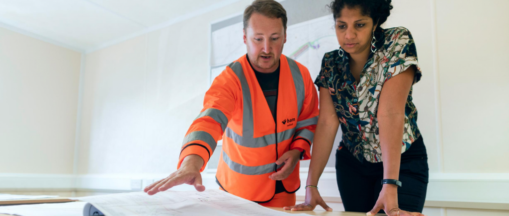 Two construction managers looking at plans