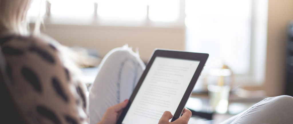 Lady reading on a tablet